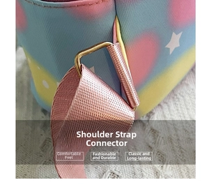 Detail of golden metal D-ring and pink woven shoulder strap on star print backpack