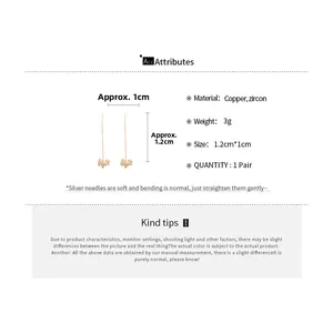 Detailed view of gold plated puppy earrings with cubic zirconia and silver needle dimensions