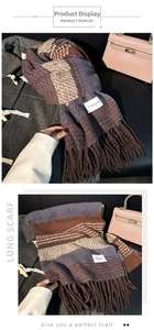 Detail of a thick checkered long scarf featuring deep purple tassels and warm knit texture