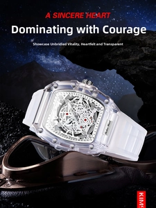 Close-up of skeleton tonneau watch with transparent case and white silicone strap