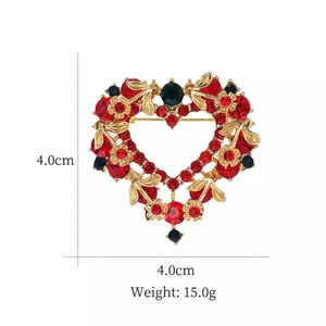 Detail view of heart-shaped rhinestone brooch showing dimensions 4.0cm width and height