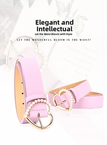 Macro shot of light purple belt with heart-shaped golden buckle and pearl inlay detail