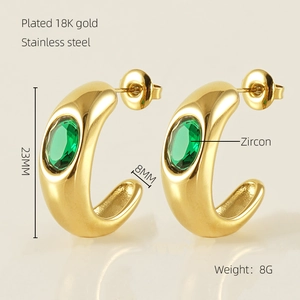 Detail of 18K gold plated stainless steel C-hoop earring with green zircon stone