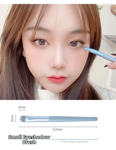 Detail view of small blue eyeshadow brush with 8mm soft bristles and size measurements