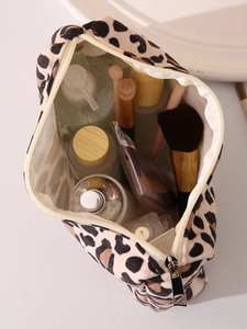 Close-up of leopard print makeup bag with metal zipper and internal storage details
