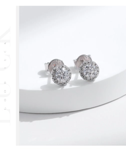 Detail view of S925 sterling silver stamp and sparkling halo moissanite stud earrings