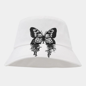 Detail shot of white cotton bucket hat featuring a black butterfly print with reflection