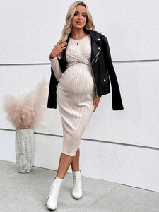 Off-white knit maternity dress with cross neckline and textured vertical stripes