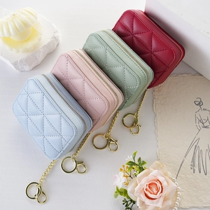Mini quilted PU leather lipstick bags with gold chains in pastel blue, pink, and green