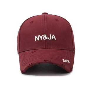 Distressed burgundy baseball cap with 3D white embroidery and vintage ripped detailing