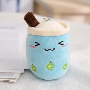 Blue bubble tea plush keychain with apple embroidery and soft fabric texture