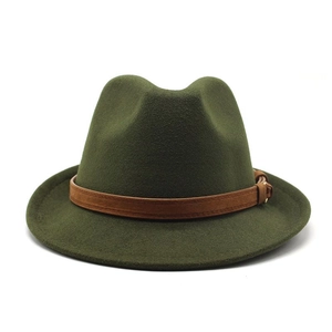 Detail of dark green wool fedora hat featuring a brown suede band and vintage buckle