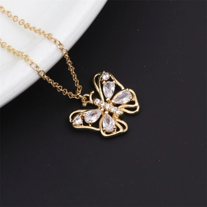 Close-up of 18K gold plated copper butterfly pendant with micro-set cubic zirconia