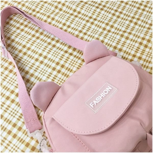 Pink bear-themed canvas messenger bag with cute ear design on yellow checkered background