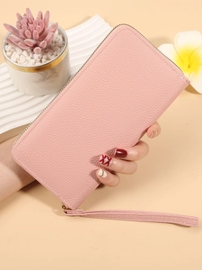 Pink long zipper wallet with lychee pattern texture and wrist strap for women