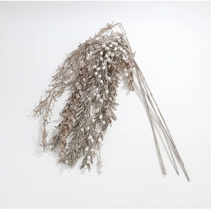 Detail of glittered branches in champagne gold and silver with elegant white pearls