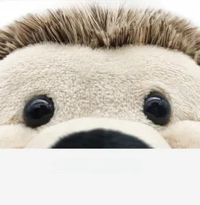 Close-up of a soft plush hedgehog toy showing realistic fur texture and cute black eyes