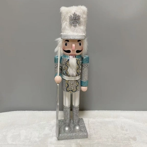 Christmas nutcracker soldier in silver and teal uniform with snowflake hat decor