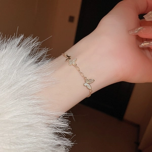 Elegant gold butterfly bracelet with mother of pearl and zircon charms for women
