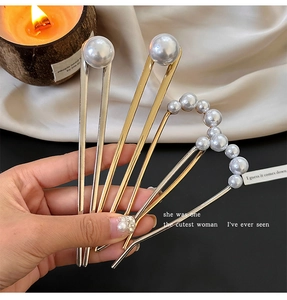 Detailed set of U-shaped pearl hairpins featuring gold, silver, and curved pearl designs