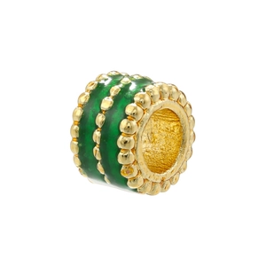 Detailed macro view of 18K gold plated bead with green enamel and beaded trim texture