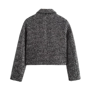 Women's black and white cropped tweed jacket with sequins shown in a back view