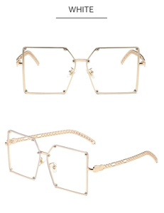 Detail of square gold metal sunglasses featuring unique chain link shaped temples
