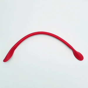 Macro view of red leather handbag strap with pre-punched stitching holes for DIY craft