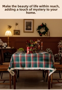 Close-up of British red and green plaid tablecloth with decorative white fringe edges