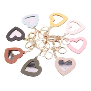 Set of heart-shaped PU leather mirror keychains in eight colors with gold metal rings