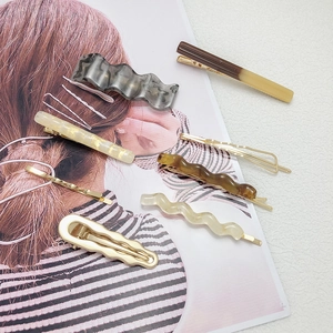 8-piece set of trendy acetate and gold metal hair clips in various colors and shapes