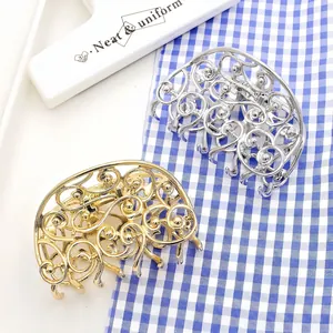 Hollow gold and silver metal butterfly hair claws with elegant filigree design