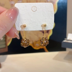 Elegant gold drop earrings with dark brown faceted crystals and delicate fine chains