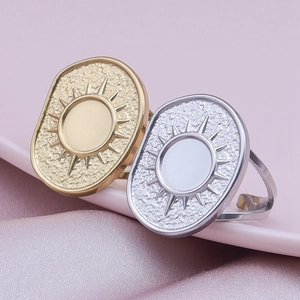 Detailed macro view of bohemian style sunburst rings with gold and silver finishes