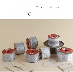 Silver Christmas ribbons collection with snowflakes and stripes for gift wrapping decoration