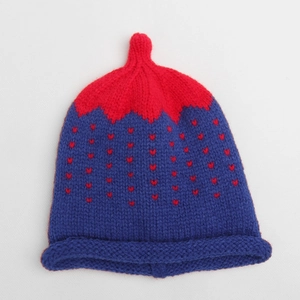 Detailed knit pattern of a navy baby hat with red heart jacquard and rolled brim