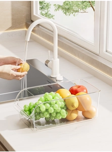 Clear PET organizer with U-shaped opening showing fresh fruit in a kitchen setting