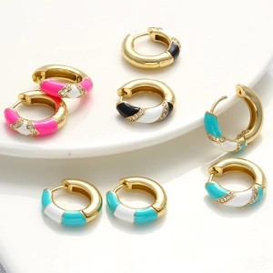 Detailed view of gold rectangle hoop earrings with enamel color blocks and zircon inlay