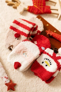 Thick Christmas coral fleece socks with snowman embroidery on a white plush background
