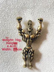 Detailed view of handmade brass muscular man pendant with measurements 44mm by 24mm