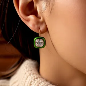 Vintage 18k gold plated square emerald green zircon earrings worn with cozy knitwear