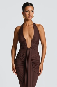 Detail of ruched front and deep V-neck on a brown halter neck elegant backless dress