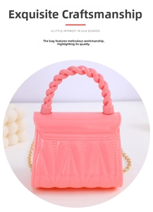 Macro detail of pink jelly mini handbag with twisted handle and golden chain strap
