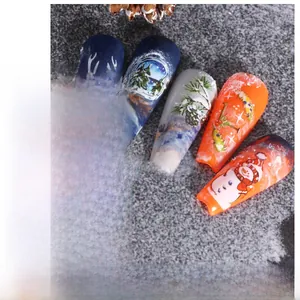 Detailed Christmas nail decals featuring snowman, gingerbread man, and elk patterns