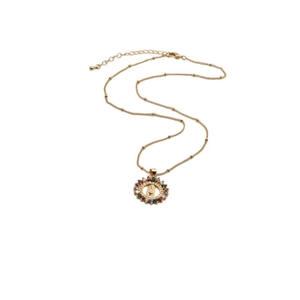 Close-up of Bohemian copper necklace featuring Virgin Mary pendant with colorful zircons
