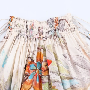Floral midi φούστα με ελαστική μέση και λεπτομέρειες από ελαφρύ μπεζ ύφασμα
