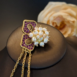 Vintage gold butterfly earrings with purple zircon crystals, pearls and long tassels