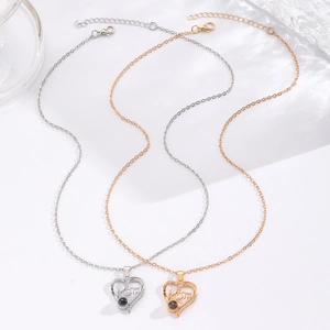 Detailed view of silver and gold heart Mom necklaces with projection stone and zircons