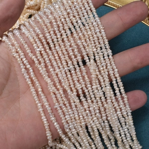 Natural mini freshwater white pearls strands 2.5mm irregular flat beads on green velvet