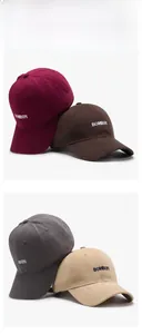 Detail of embroidered letters on four colors of soft cotton canvas baseball caps